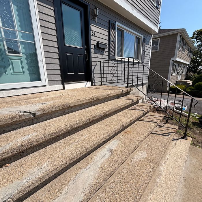 Before: worn and patched concrete steps