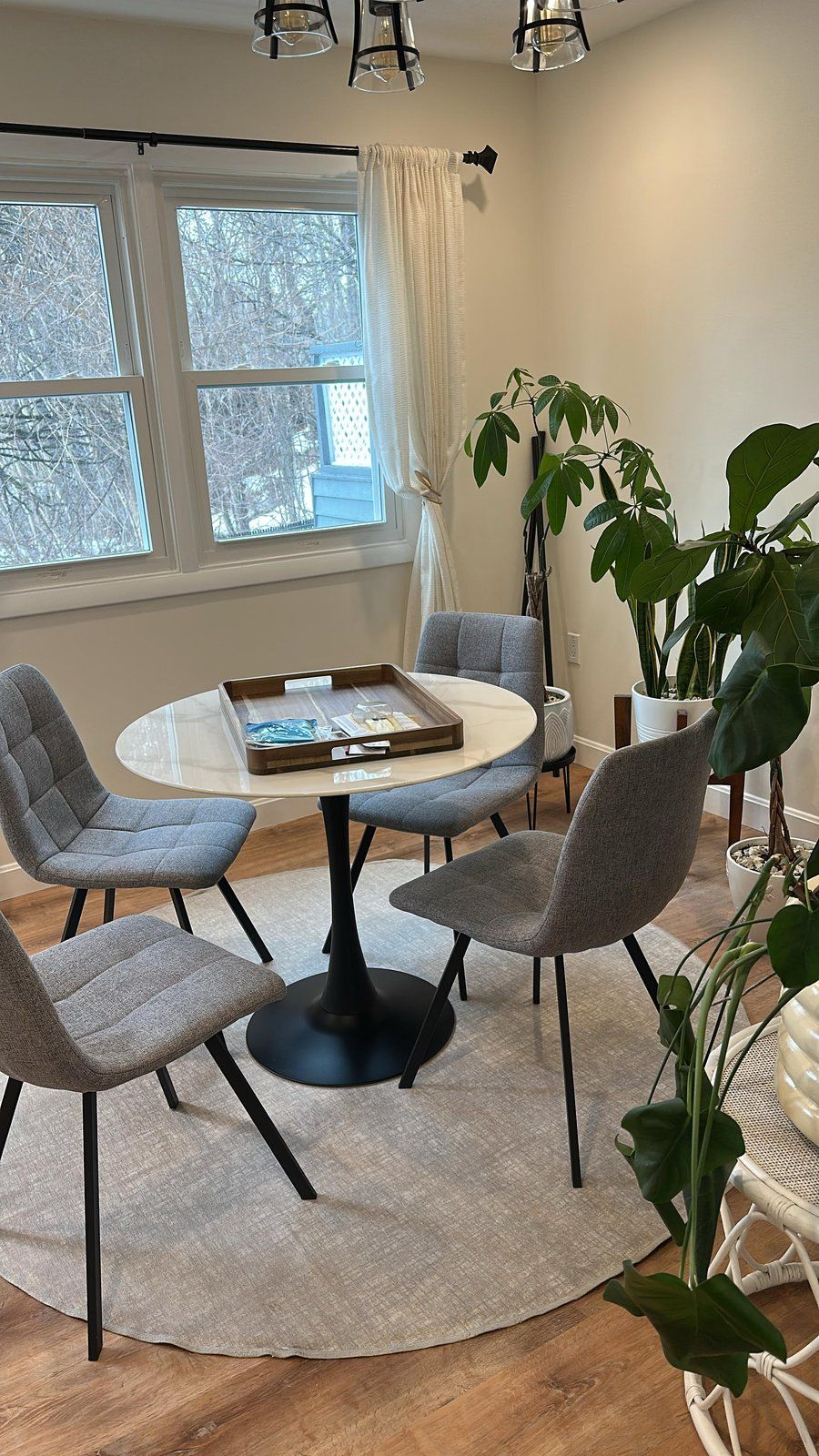 Restored dining area in West Roxbury MA home with new floors paint and lighting — completed by SR Enterprises