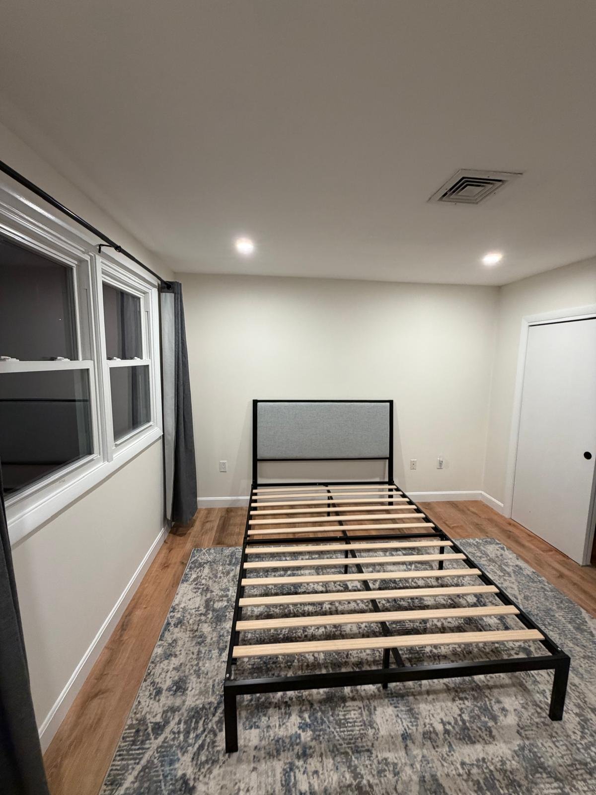 View toward kitchen pass-through in restored West Roxbury home showing connected restoration scope — SR Enterprises