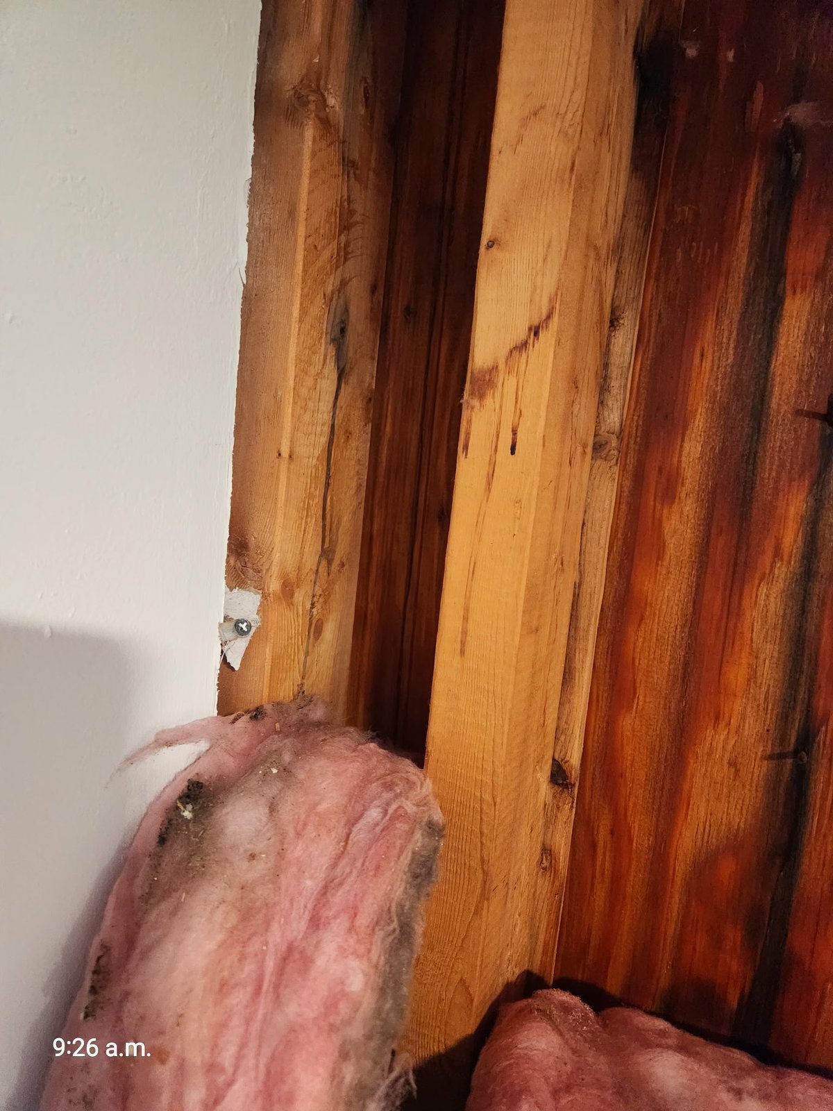 Wall corner framing detail in West Roxbury MA showing water staining and remnant insulation — SR Enterprises insurance documentation