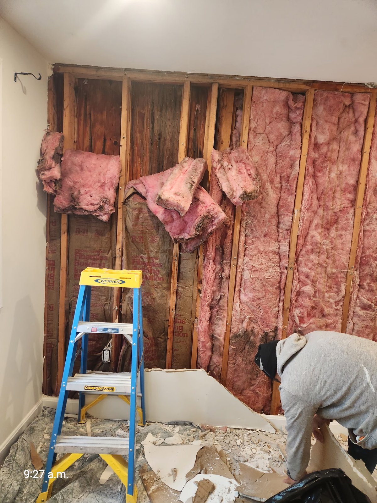Mold staining and water damage on framing visible after drywall removal in West Roxbury MA home — SR Enterprises documentation