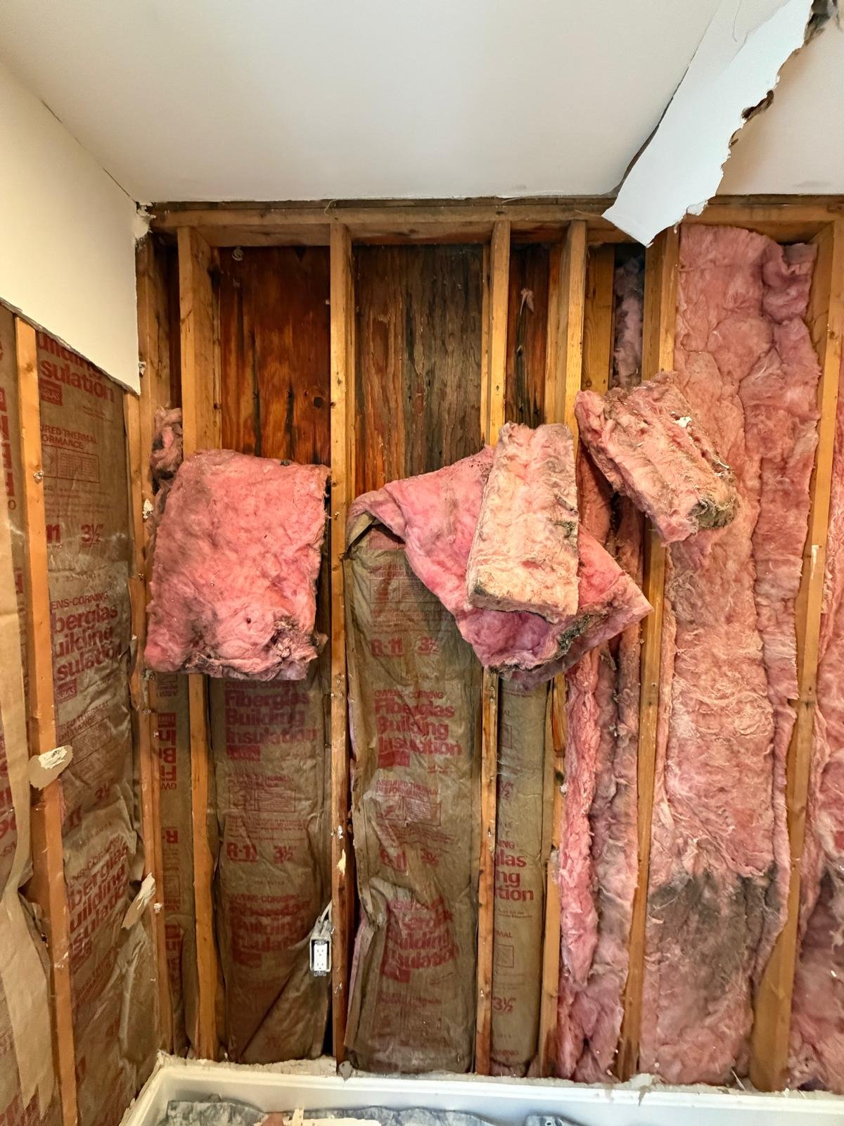 Room overview showing extent of water damage across multiple wall sections in West Roxbury MA — SR Enterprises insurance documentation